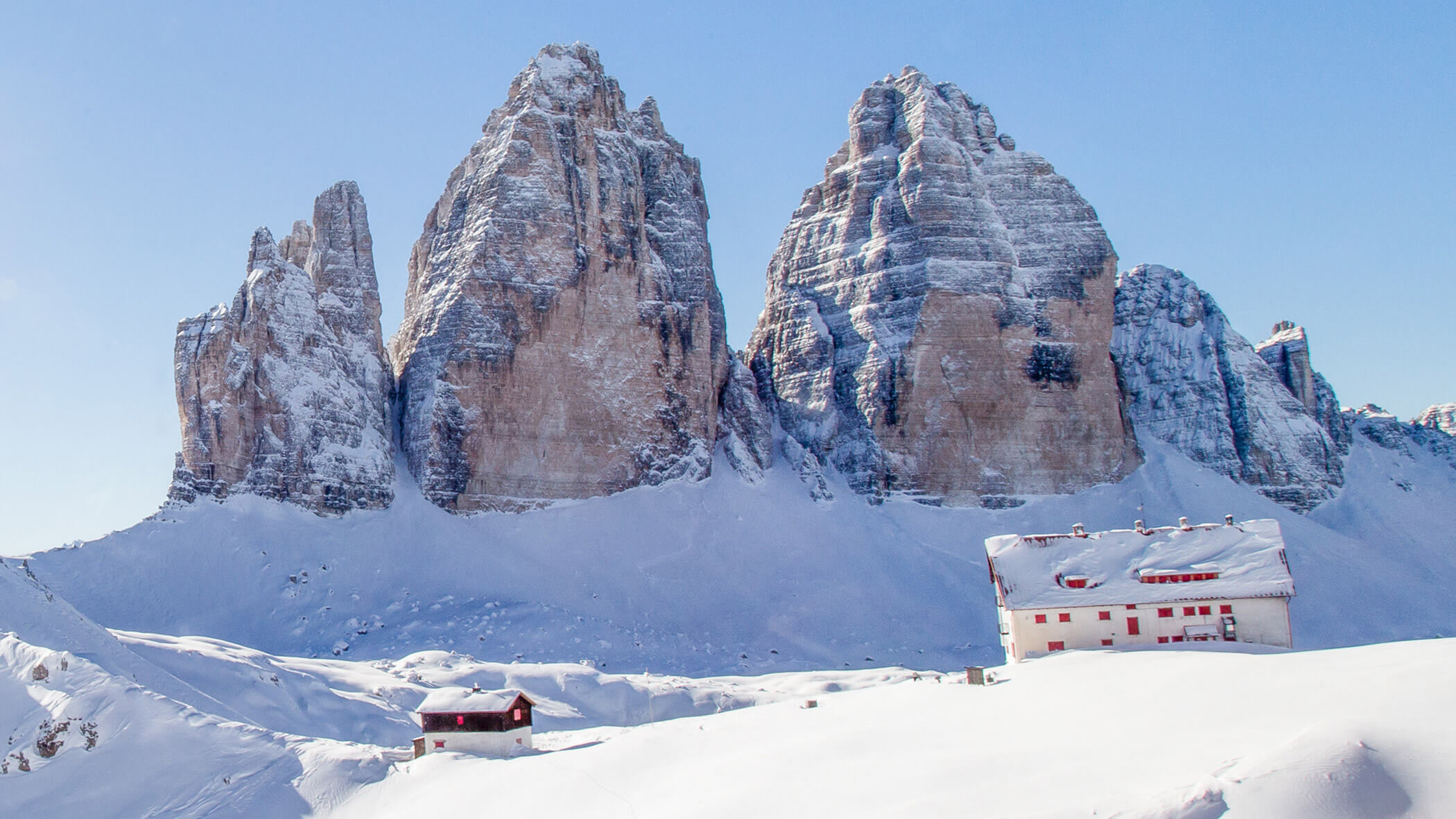 Three Peaks and Three Peaks Hut in snowy winter - OLM Nature Escape