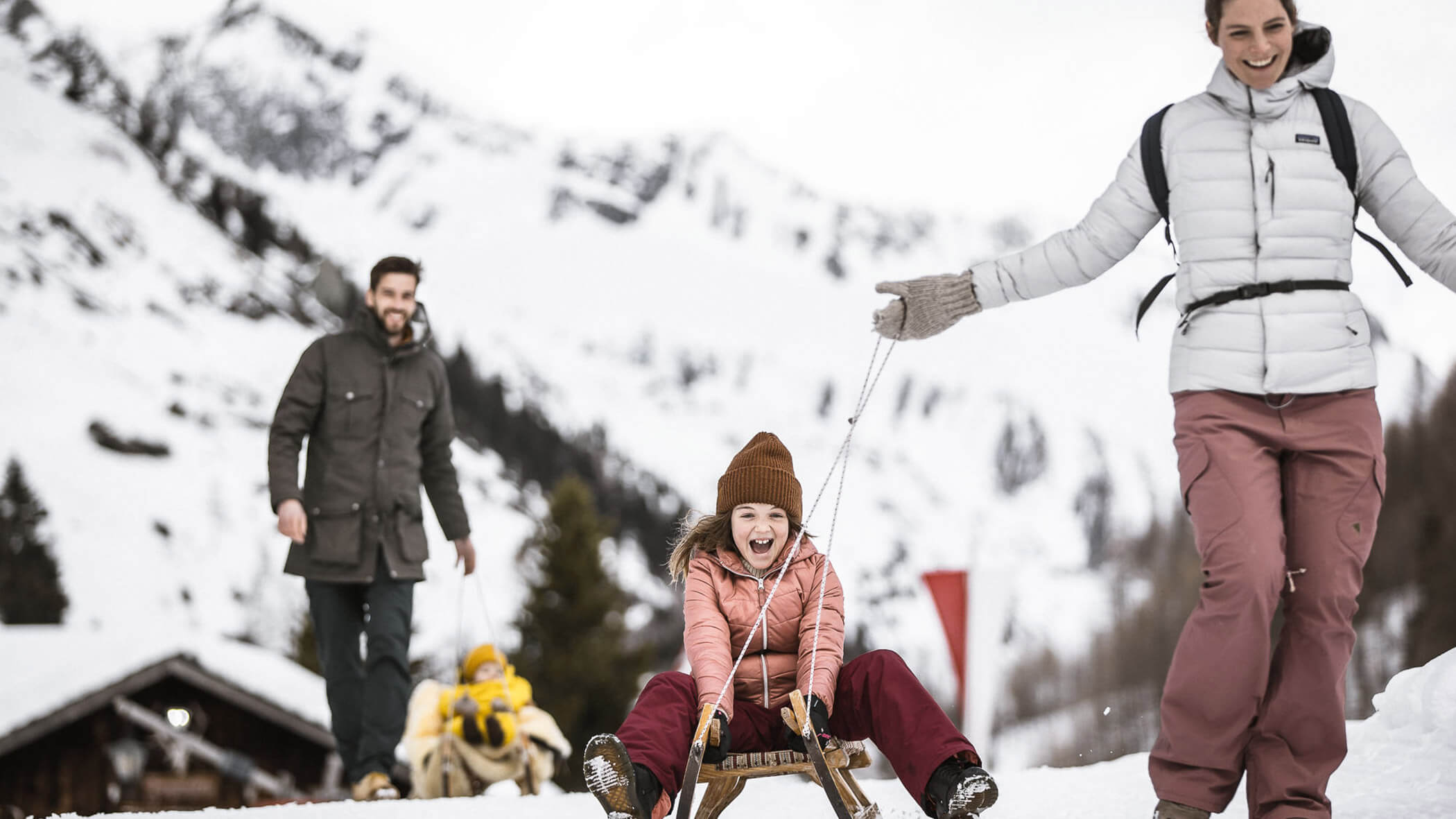 Family sledding - OLM Nature Escape