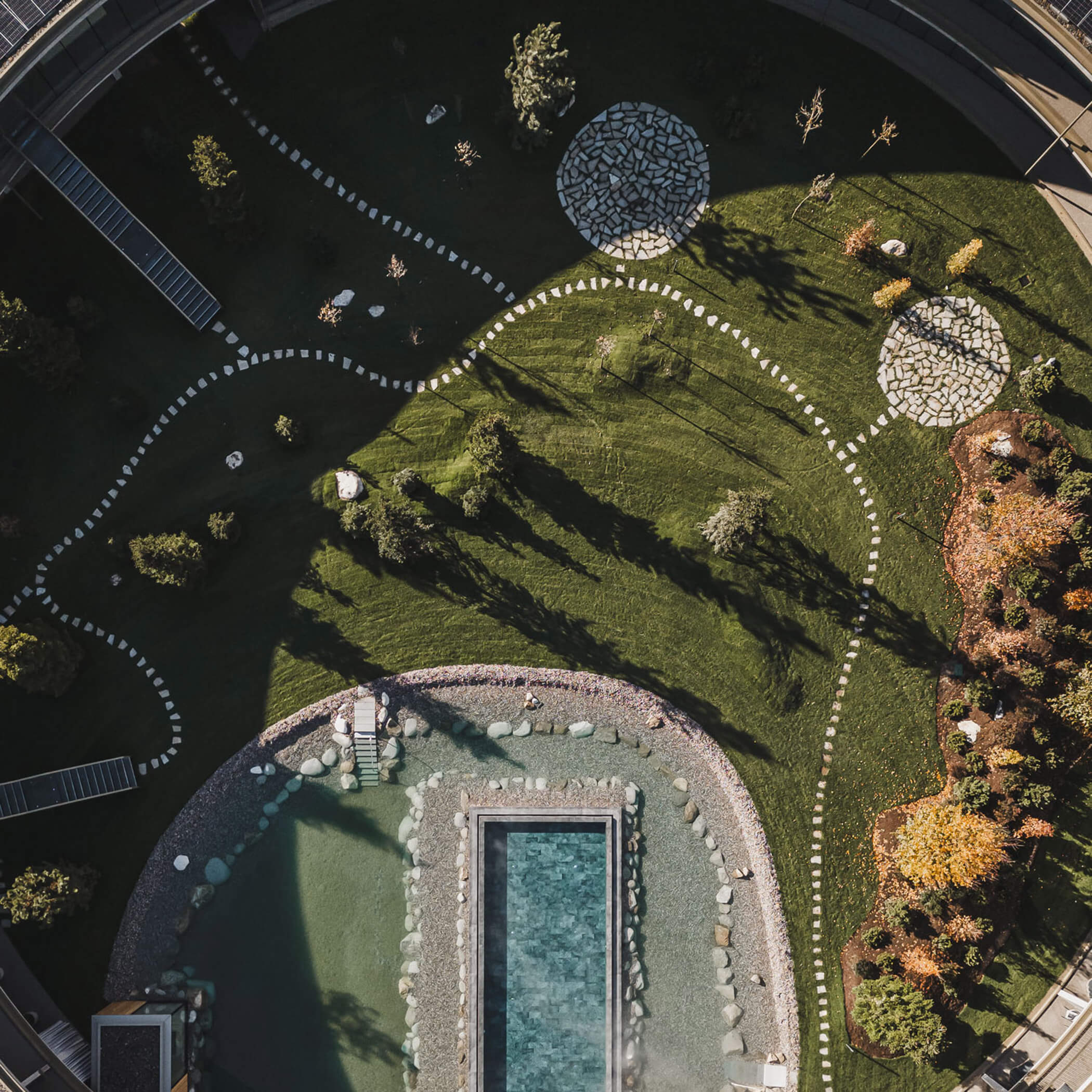 Top view of the courtyard with pool, natural swimming pond and garden - OLM Nature Escape