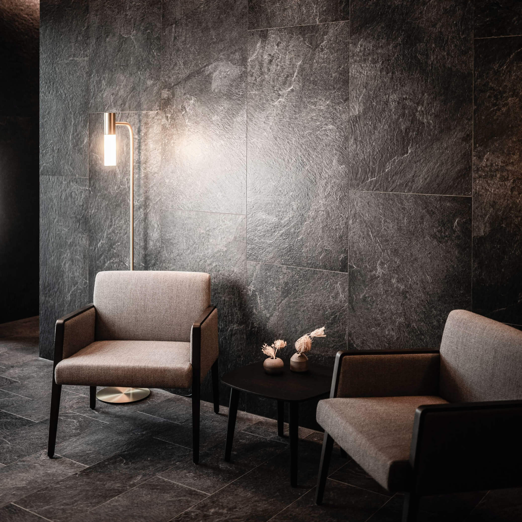 Dark, elegant tiles and two chairs in the beauty area - OLM Nature Escape