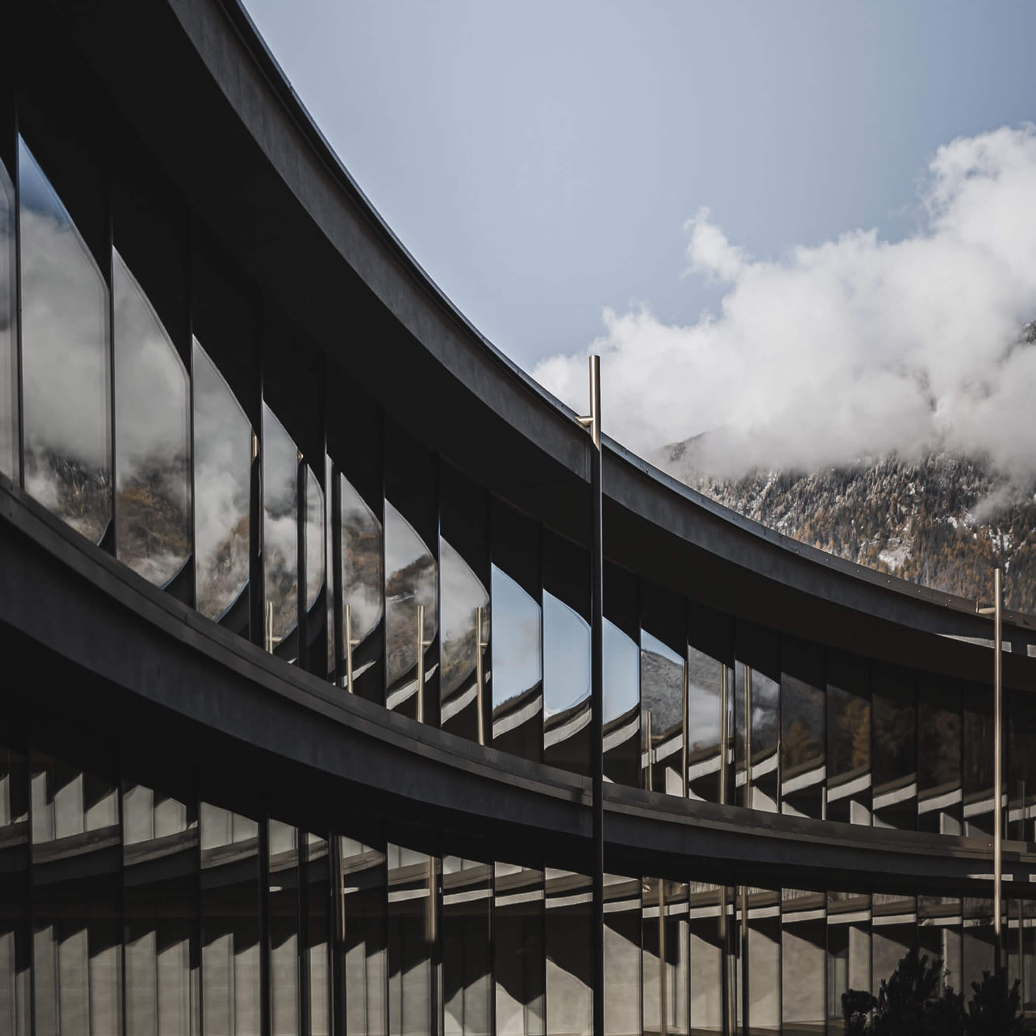 Glass facade of the inner circle of the aparthotel - OLM Nature Escape